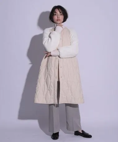 HERENCIA / High neck quilted knit coat